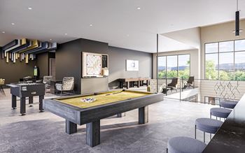 a game room with a pool table and a bar